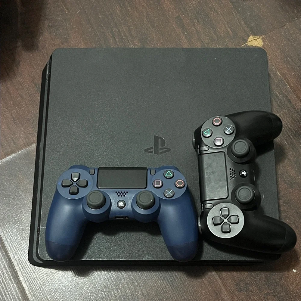 Sony PlayStation 4 Console with Black and Blue Controllers